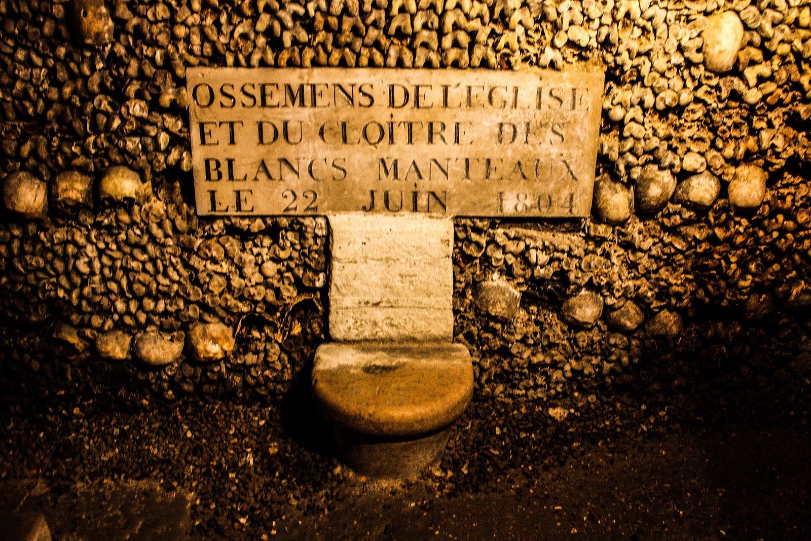 Rows of bones in the galleries of the Paris Catacombs ossuary, beneath the 14th arrondissement